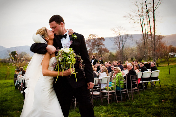the happy couple kissing as they leave the ceremony - photo by Holland Photo Arts the happy couple kissing as they leave the ceremony - photo by Holland Photo Arts