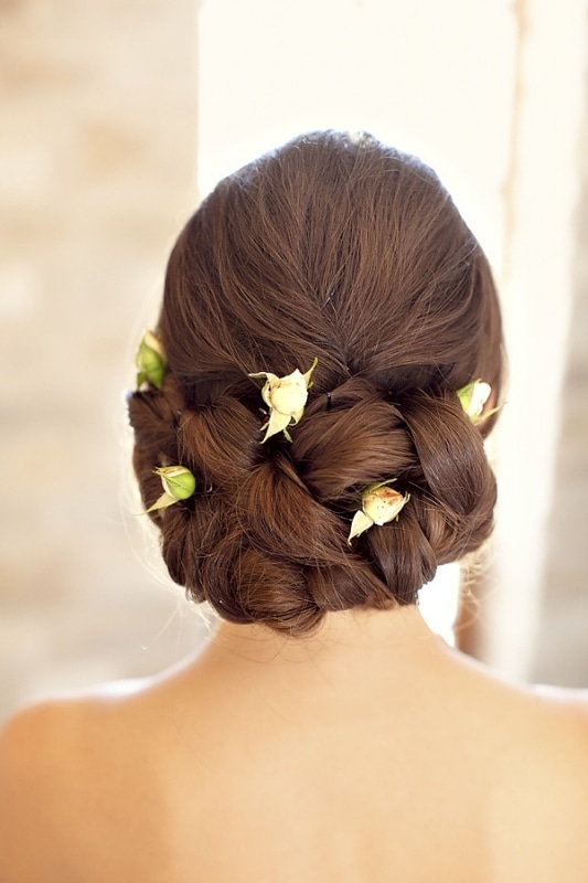 braided brides updo with white roses for vineyard wedding at Sunstone Winery, photo by Ashleigh Taylor Photography braided brides updo with white roses for vineyard wedding at Sunstone Winery, photo by Ashleigh Taylor Photography