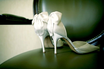 Image by Mel Barlow Photography, bow backed white wedding shoes Image by Mel Barlow Photography, bow backed white wedding shoes
