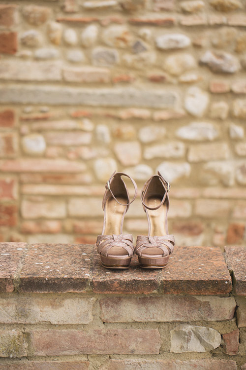 pink wedding shoes at a destination wedding in Italy - photo by Whitewall Photography | junebugweddings.com pink wedding shoes at a destination wedding in Italy - photo by Whitewall Photography | junebugweddings.com