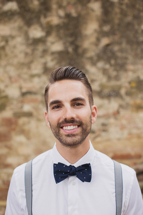 stylish grrom in navy bow tie and suspenders at a destination wedding in Italy - photo by Whitewall Photography | junebugweddings.com stylish grrom in navy bow tie and suspenders at a destination wedding in Italy - photo by Whitewall Photography | junebugweddings.com