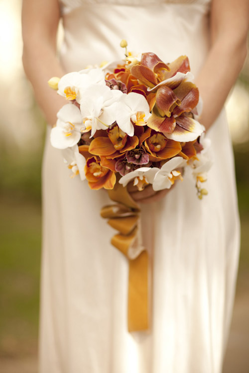 orange and cream fall orchid wedding bouquet by Louloudi Design, photo by Allyson Magda | junebugweddings.com orange and cream fall orchid wedding bouquet by Louloudi Design, photo by Allyson Magda | junebugweddings.com