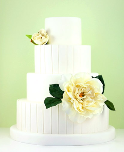 Beautiful white modern fondant wedding cake with pretty floral decoration from Eat Cake Be Merry Beautiful white modern fondant wedding cake with pretty floral decoration from Eat Cake Be Merry