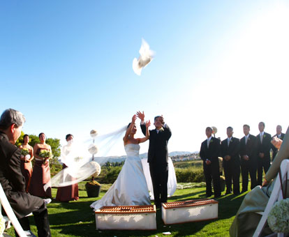Releasing doves during an outdoor wedding ceremony, image by GH Kim Photography Releasing doves during an outdoor wedding ceremony, image by GH Kim Photography
